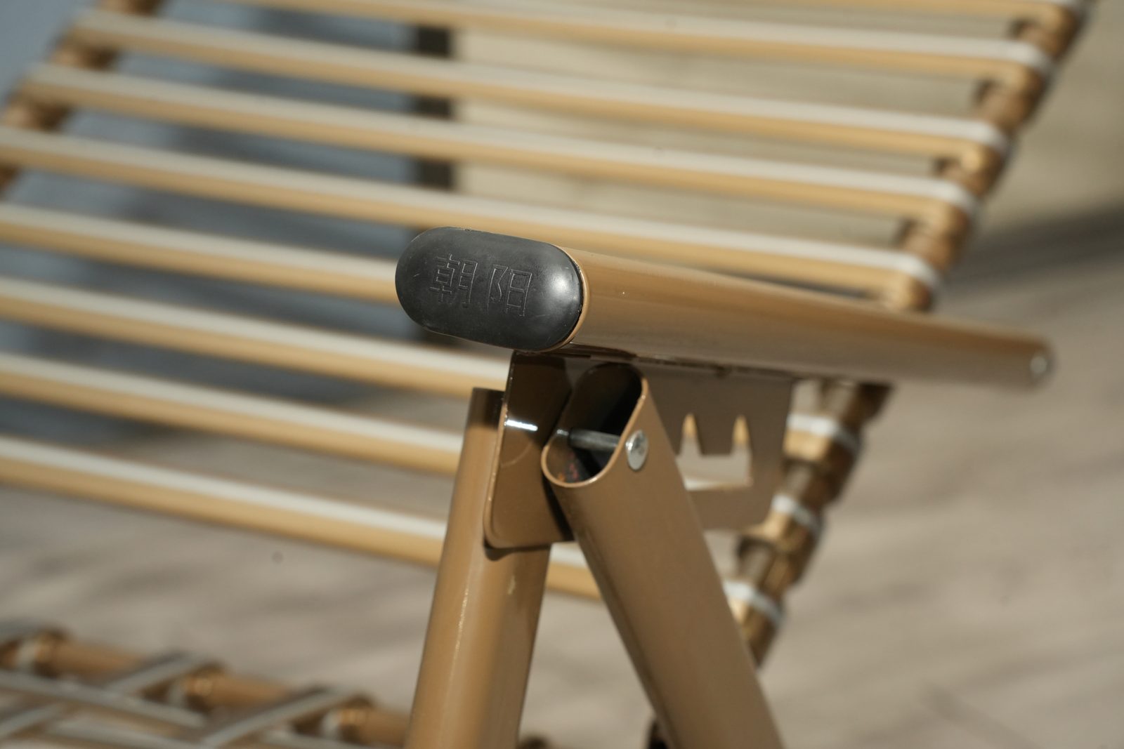 Adjustment latch and branded end cap